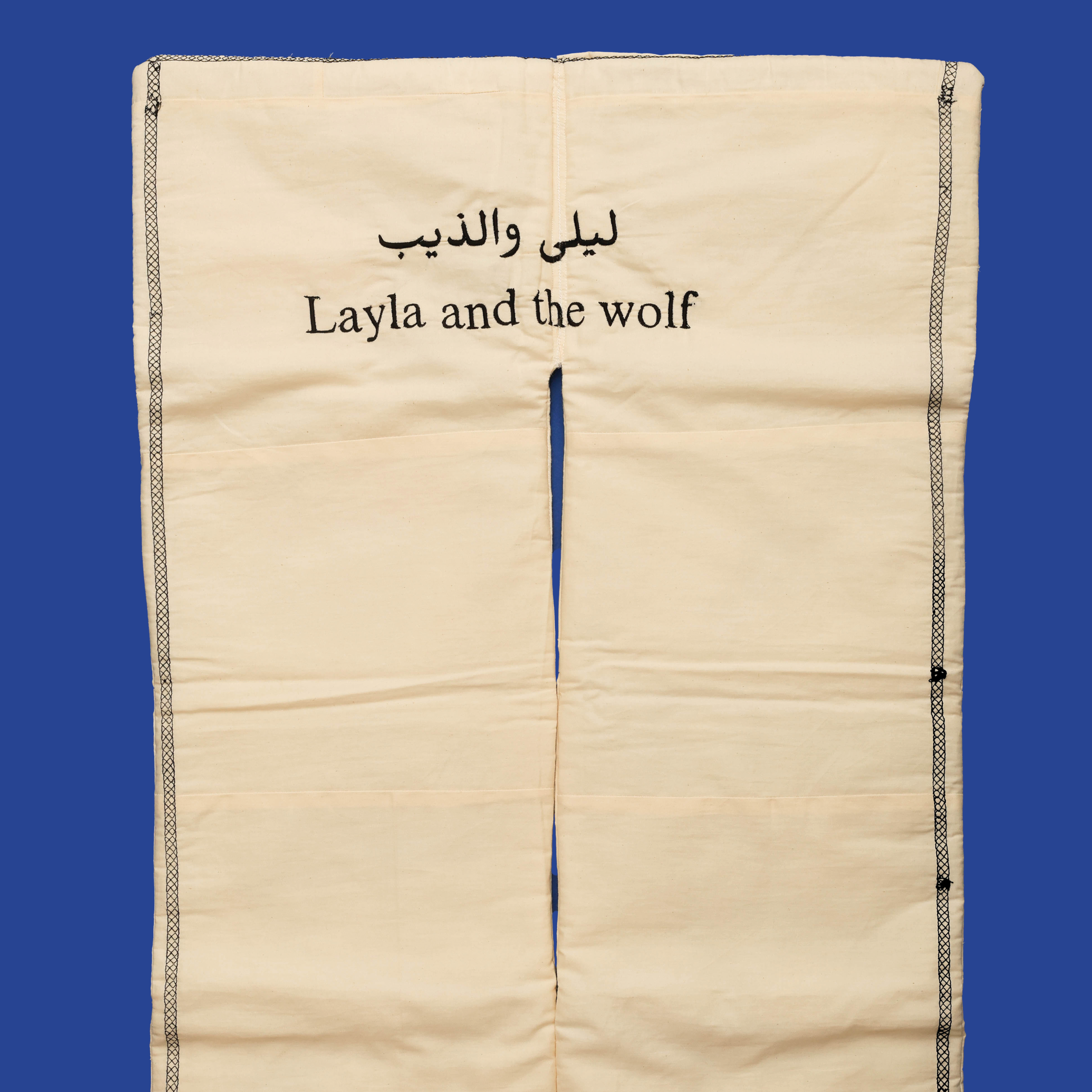 Title: The wolf ate them الذئب اكلهم Year: 2023 Mediums: Machine embroidery on cotton fabric with cotton filling Size: 95 cm x 51 cm