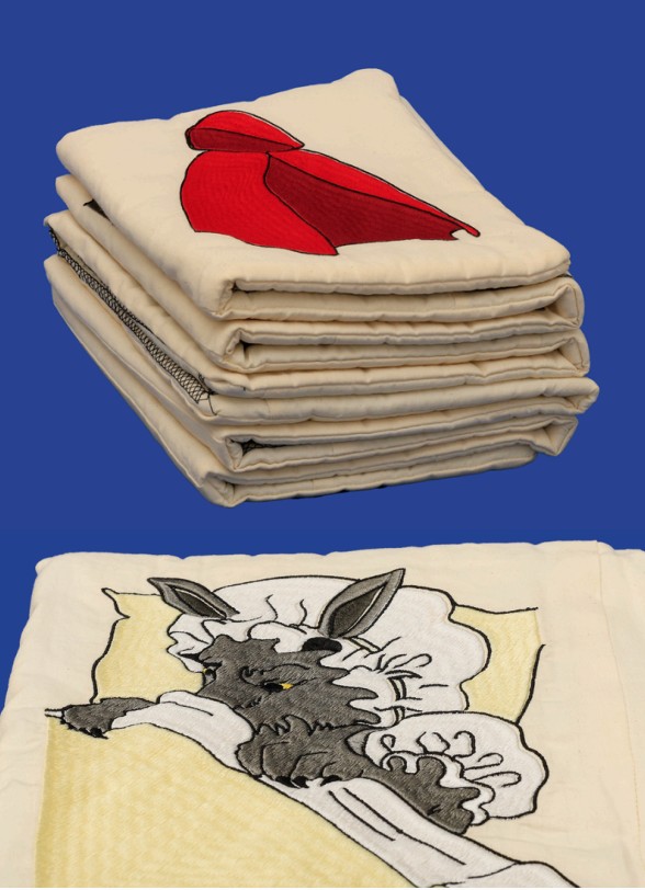 Title: The wolf ate them الذئب اكلهم Year: 2023 Mediums: Machine embroidery on cotton fabric with cotton filling Size: 95 cm x 51 cm